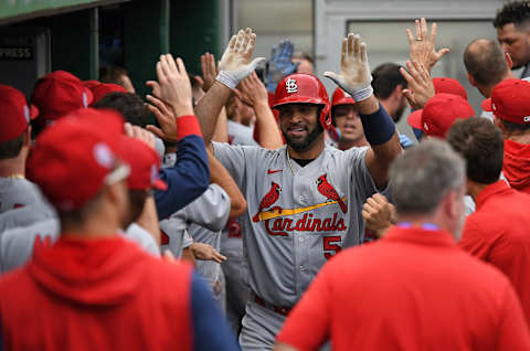 PITTSBURGH, PA – SEPTEMBER 11: Albert Pujols #5 of the St. Louis Cardinals celebrates with teammates in the dugout after hitting a two-run home run in the ninth inning during the game against the Pittsburgh Pirates at PNC Park on September 11, 2022 in Pittsburgh, Pennsylvania. The home run was the 697th of Pujols career, moving him to 4th place all time in MLB home runs. (Photo by Justin Berl/Getty Images)