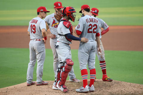 SAN DIEGO, CALIFORNIA – OCTOBER 02: Tommy Edman #19, Paul DeJong #11, Kolten Wong #16 and Yadier Molina #4 talk with Jack Flaherty #22 of the St. Louis Cardinals during the fifth inning of Game Three of the National League Wild Card Series against the San Diego Padres at PETCO Park on October 02, 2020 in San Diego, California. (Photo by Sean M. Haffey/Getty Images)