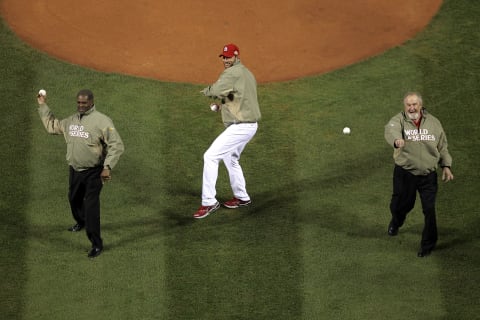 ST LOUIS, MO – OCTOBER 19: (L-R) Former pitcher Bob Gibson, former pitcher Bruce Sutter and Adam Wainwright of the St. Louis Cardinals throw out the ceremonial first pitch prior to Game One of the MLB World Series against the Texas Rangers at Busch Stadium on October 19, 2011 in St Louis, Missouri. (Photo by Ezra Shaw/Getty Images)