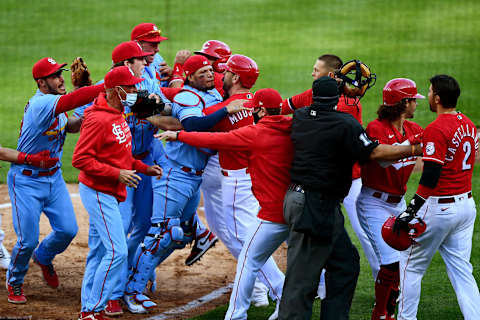 CINCINNATI, OHIO – APRIL 03: Benches clear after Nick Castellanos #2 of the Cincinnati Reds slides safely into home base to score on a wild pitch and celebrates over pitcher Jake Woodford #40 of the St. Louis Cardinals during their game at Great American Ball Park on April 03, 2021 in Cincinnati, Ohio. The Cincinnati Reds won 9-6. (Photo by Emilee Chinn/Getty Images)