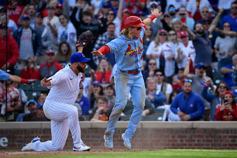 Harrison Bader #48 of the St. Louis Cardinals reacts after scoring on a passed ball in the night inning against Tommy Nance #45 of the Chicago Cubs at Wrigley Field on September 25, 2021 in Chicago, Illinois. (Photo by Quinn Harris/Getty Images)