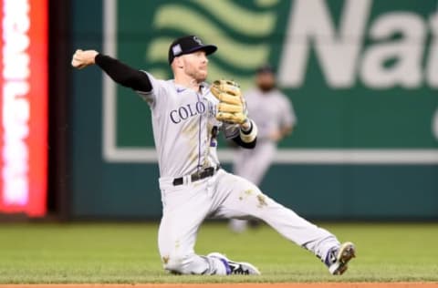 WASHINGTON, DC – SEPTEMBER 17: Trevor Story #27 of the Colorado Rockies throws the ball to first base against the Washington Nationals at Nationals Park on September 17, 2021 in Washington, DC. (Photo by G Fiume/Getty Images)