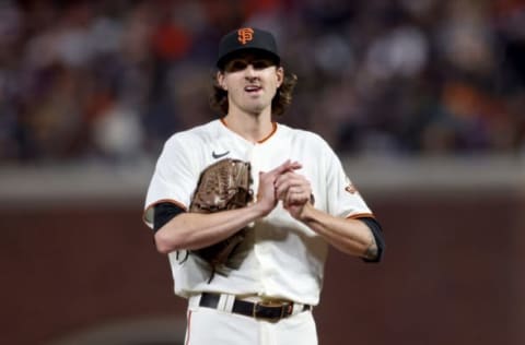 SAN FRANCISCO, CALIFORNIA – OCTOBER 09: Kevin Gausman #34 of the San Francisco Giants looks on before being relieved in the sixth inning against the Los Angeles Dodgers during Game 2 of the National League Division Series at Oracle Park on October 09, 2021 in San Francisco, California. (Photo by Harry How/Getty Images)