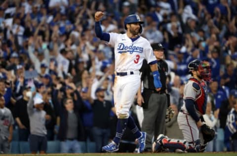 LOS ANGELES, CALIFORNIA – OCTOBER 19: Chris Taylor #3 of the Los Angeles Dodgers score on a double by Mookie Betts #50 during the 8th inning of Game 3 of the National League Championship Series against the Atlanta Braves at Dodger Stadium on October 19, 2021 in Los Angeles, California. (Photo by Harry How/Getty Images)