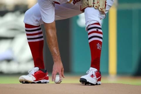 ST. LOUIS, MO – MAY 15: Adam Wainwright #50 of the St. Louis Cardinals picks up a game ball as he takes the mound during the first inning against the San Francisco Giants at Busch Stadium on May 15, 2022 in St. Louis, Missouri. (Photo by Scott Kane/Getty Images)