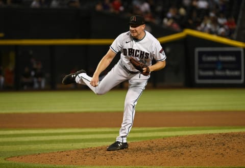 PHOENIX, ARIZONA – JUNE 14: Mark Melancon #34 of the Arizona Diamondbacks delivers a pitch against the Cincinnati Reds at Chase Field on June 14, 2022 in Phoenix, Arizona. (Photo by Norm Hall/Getty Images)