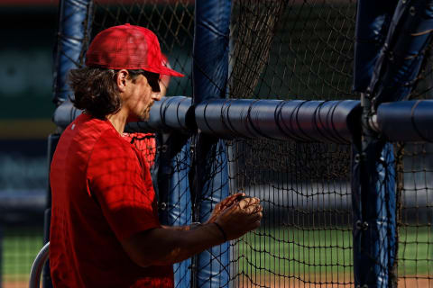 MILWAUKEE, WISCONSIN – JUNE 21: Jeff Albert #54 of the St. Louis Cardinals videos from his phone a hitter during batting practice as the sun shines through the stadium panels before the game against the Milwaukee Brewers at American Family Field on June 21, 2022 in Milwaukee, Wisconsin. Cardinals defeated the Brewers 6-2. (Photo by John Fisher/Getty Images)