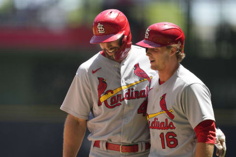 Paul Goldschmidt #46 of the St. Louis Cardinals celebrates with Nolan Gorman #16 after hitting a double and scoring on an error. (Photo by Patrick McDermott/Getty Images)