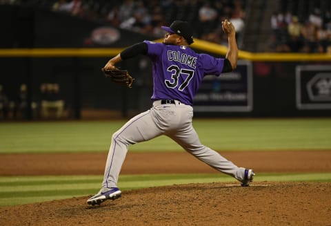 PHOENIX, ARIZONA – JULY 08: Alex Colome #37 of the Colorado Rockies delivers a pitch against the Arizona Diamondbacks at Chase Field on July 08, 2022 in Phoenix, Arizona. (Photo by Norm Hall/Getty Images)