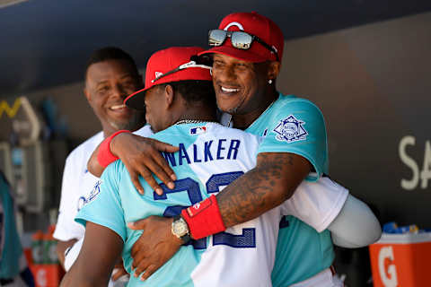 LOS ANGELES, CALIFORNIA – JULY 16: First Base Coach Eric Davis hugs Jordan Walker #22 of the National League before the SiriusXM All-Star Futures Game at Dodger Stadium on July 16, 2022 in Los Angeles, California. (Photo by Kevork Djansezian/Getty Images)