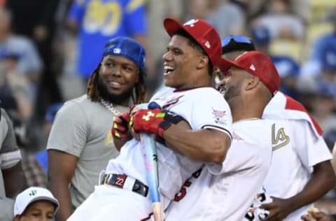 LOS ANGELES, CALIFORNIA – JULY 18: Albert Pujols #5 of the St. Louis Cardinals picks up Juan Soto #22 of the Washington Nationals during the 2022 T-Mobile Home Run Derby at Dodger Stadium on July 18, 2022 in Los Angeles, California. (Photo by Kevork Djansezian/Getty Images)