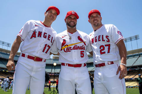 Shohei Ohtani #17 and Mike Trout #27 of the Los Angeles Angels pose for a photo with Albert Pujols #5 of the St. Louis Cardinals during the Gatorade All-Star Workout Day at Dodger Stadium on Tuesday, July 18, 2022 in Los Angeles, California. (Photo by Brace Hemmelgarn/Minnesota Twins/Getty Images)