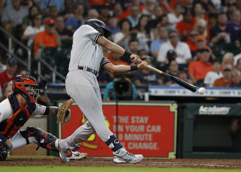 HOUSTON, TEXAS – JULY 21: Matt Carpenter #24 of the New York Yankees hit a line drive to Yuli Gurriel #10 of the Houston Astros in the third inning for an unassisted double play against the New York Yankees during game one of a doubleheader at Minute Maid Park on July 21, 2022 in Houston, Texas. (Photo by Bob Levey/Getty Images)