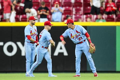 CINCINNATI, OH – JULY 23: Dylan Carlson #3, Tyler O’Neill #27 and Lars Nootbaar #21 of the St. Louis Cardinals celebrate after beating the Cincinnati Reds 6-3 at Great American Ball Park on July 23, 2022 in Cincinnati, Ohio. (Photo by Lauren Bacho/Getty Images)