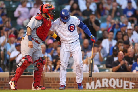 Willson Contreras of the Chicago Cubs greets Yadier Molina (Photo by Michael Reaves/Getty Images)