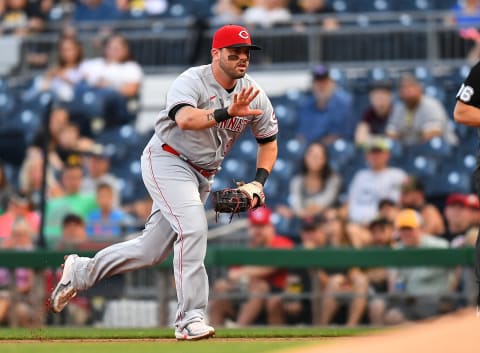 Mike Moustakas #9 of the Cincinnati Reds in action during the game against the Pittsburgh Pirates. (Photo by Joe Sargent/Getty Images)