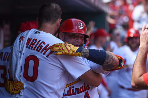 Yadier Molina #4 of the St. Louis Cardinals is congratulated by Adam Wainwright. (Photo by Joe Puetz/Getty Images)