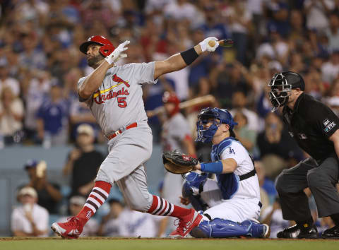 LOS ANGELES, CALIFORNIA – SEPTEMBER 23: Albert Pujols #5 of the St. Louis Cardinals hits his 700th career homerun in front of Will Smith #16 of the Los Angeles Dodgers, a three run homerun to take a 5-0 lead, during the fourth inning at Dodger Stadium on September 23, 2022 in Los Angeles, California. (Photo by Harry How/Getty Images)