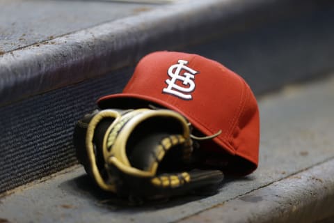 MILWAUKEE, WI – APRIL 16: A St. Louis Cardinals cap and glove rest on the step to the dugout during the game against the Milwaukee Brewers at Miller Park on April 16, 2014 in Milwaukee, Wisconsin. (Photo by Mike McGinnis/Getty Images)