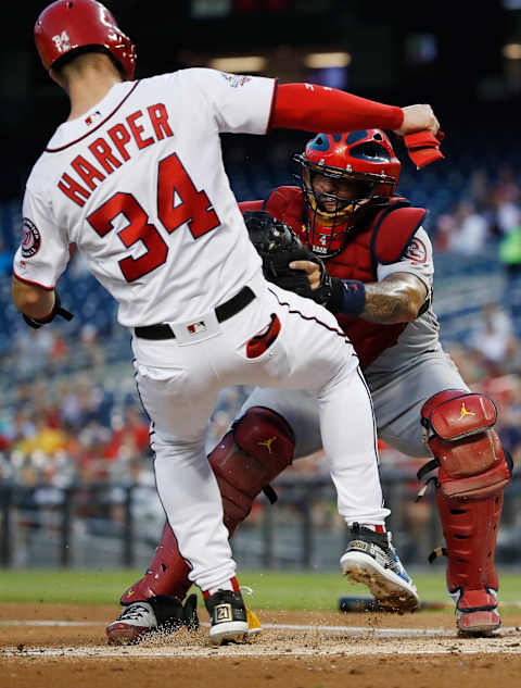 WASHINGTON, DC – SEPTEMBER 05: Yadier Molina #4 of the St. Louis Cardinals tags out Bryce Harper #34 of the Washington Nationals at home plate to end the first inning at Nationals Park on September 5, 2018 in Washington, DC. (Photo by Patrick McDermott/Getty Images)