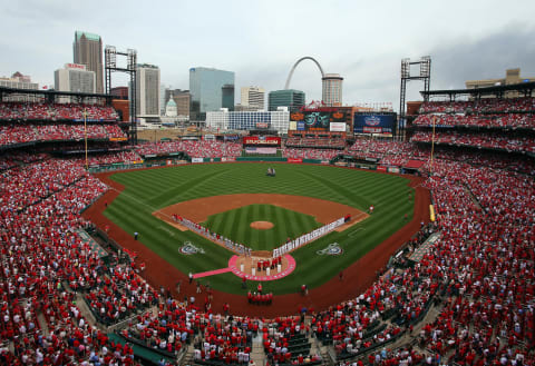 ST. LOUIS, MO – APRIL 08: General view of the St. Louis Cardinals and the Cincinnati Reds line up for the national anthem before the Opening Day on April 8, 2013 at Busch Stadium in St. Louis, Missouri. (Photo by Elsa/Getty Images)