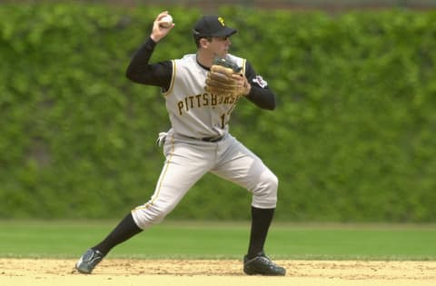 CHICAGO – MAY 23: Shortstop Jack Wilson #12 of the Pittsburgh Pirates throws to first base during the MLB game against the Chicago Cubs at Wrigley Field in Chicago, Illinois on May 23, 2002. The Cubs won 11-6. (Photo by Jonathan Daniel/Getty Images)