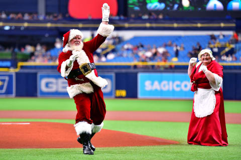 ST. PETERSBURG, FLORIDA – JULY 21: Santa Claus delivers the first pitch at the Christmas in July baseball game between the Tampa Bay Rays and the Chicago White Sox at Tropicana Field on July 21, 2019 in St. Petersburg, Florida. (Photo by Julio Aguilar/Getty Images)