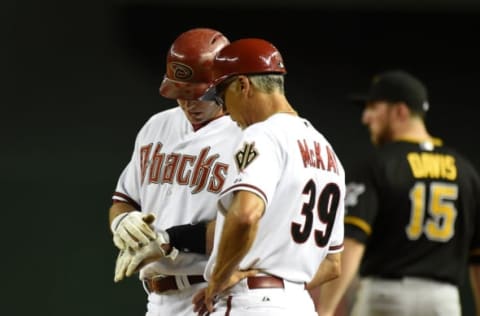 PHOENIX, AZ – AUGUST 01: Paul Goldschmidt #44 of the Arizona Diamondbacks shows first base coach Dave McKay #39 where he got hit by a pitch during the ninth inning against the Pittsburgh Pirates at Chase Field on August 1, 2014 in Phoenix, Arizona. Pittsburgh won 9-4. (Photo by Norm Hall/Getty Images)