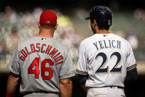 MILWAUKEE, WISCONSIN – AUGUST 28: Paul Goldschmidt #46 of the St. Louis Cardinals and Christian Yelich #22 of the Milwaukee Brewers meet at first base in the eighth inning at Miller Park on August 28, 2019 in Milwaukee, Wisconsin. (Photo by Dylan Buell/Getty Images)