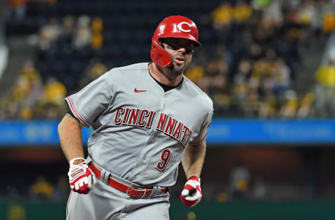 Mike Moustakas #9 of the Cincinnati Reds rounds the bases after hitting a solo home run to center field in the seventh inning during the game against the Pittsburgh Pirates at PNC Park on May 13, 2022 in Pittsburgh, Pennsylvania. (Photo by Justin Berl/Getty Images)