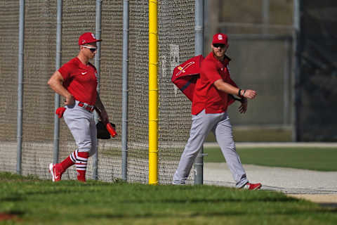 Feb 26, 2021; Jupiter, Florida, USA; St. Louis Cardinals left fielder Austin Dean (0) and left fielder Tyler O’Neill (41) walks to a field during spring training workouts at Roger Dean Stadium. Mandatory Credit: Jasen Vinlove-USA TODAY Sports