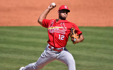 Jordan Hicks (12) pitches against the New York Mets during a spring training game at Clover Park. Mandatory Credit: Jim Rassol-USA TODAY Sports