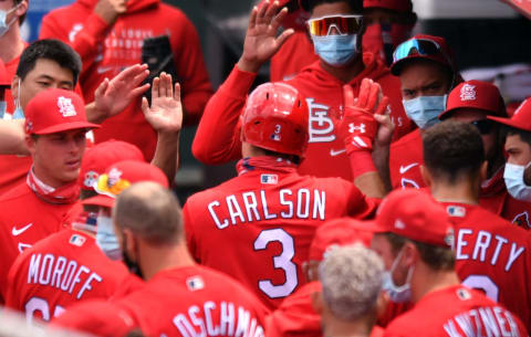 Mar 22, 2021; Jupiter, Florida, USA; St. Louis Cardinals outfielder Dylan Carlson (3) is congratulated by teammates after hitting a solo home run in the second inning of a spring training game against the Miami Marlins at Roger Dean Chevrolet Stadium. Mandatory Credit: Jim Rassol-USA TODAY Sports