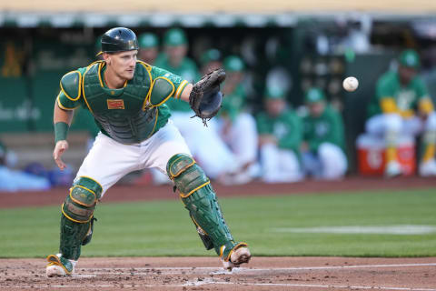 May 14, 2022; Oakland, California, USA; Oakland Athletics catcher Sean Murphy (12) catches a throw to record a force out against the Los Angeles Angels during the second inning at RingCentral Coliseum. Mandatory Credit: Darren Yamashita-USA TODAY Sports