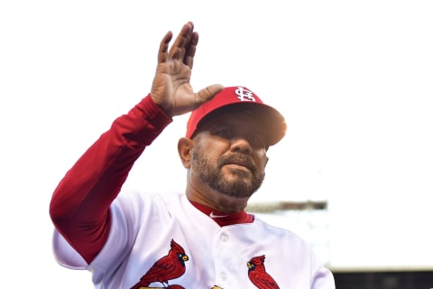 Apr 5, 2018; St. Louis, MO, USA; St. Louis Cardinals third base coach Jose Oquendo (11) waves to fans prior to a game against the Arizona Diamondbacks at Busch Stadium. Mandatory Credit: Jeff Curry-USA TODAY Sports