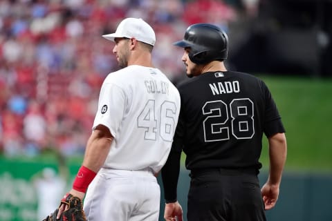 Paul Goldschmidt (46) talks with Colorado Rockies third baseman Nolan Arenado (28) during the first inning of a game during an MLB Players’ Weekend game at Busch Stadium. Mandatory Credit: Jeff Curry-USA TODAY Sports