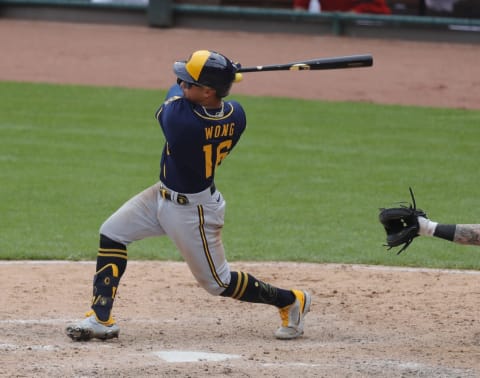 May 23, 2021; Cincinnati, Ohio, USA; Milwaukee Brewers second baseman Kolten Wong (16) bats against the Cincinnati Reds during the eighth inning at Great American Ball Park. Mandatory Credit: David Kohl-USA TODAY Sports