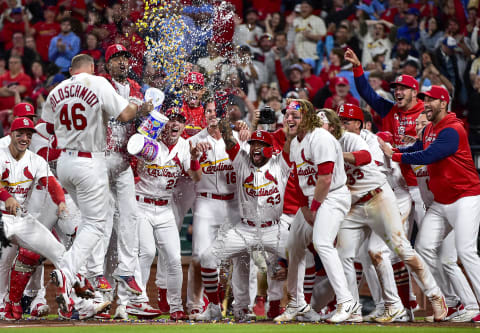 May 23, 2022; St. Louis, Missouri, USA; St. Louis Cardinals first baseman Paul Goldschmidt (46) is congratulated by teammates at home plate after hitting a walk-off grand slam against the Toronto Blue Jays during the tenth inning at Busch Stadium. Mandatory Credit: Jeff Curry-USA TODAY Sports