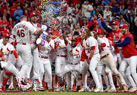 May 23, 2022; St. Louis, Missouri, USA; St. Louis Cardinals first baseman Paul Goldschmidt (46) is congratulated by teammates at home plate after hitting a walk-off grand slam against the Toronto Blue Jays during the tenth inning at Busch Stadium. Mandatory Credit: Jeff Curry-USA TODAY Sports