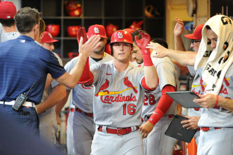 Jun 21, 2022; Milwaukee, Wisconsin, USA; St. Louis Cardinals third baseman Nolan Gorman (16) is congratulated in the dugout after hitting a home run against the Milwaukee Brewers in the fourth inning at American Family Field. Mandatory Credit: Michael McLoone-USA TODAY Sports