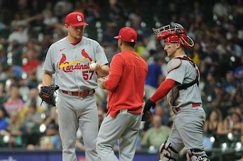 Jun 21, 2022; Milwaukee, Wisconsin, USA; St. Louis Cardinals relief pitcher Zack Thompson (57) hands the ball to St. Louis Cardinals manager Oliver Marmol (37) in the fifth inning against the Milwaukee Brewers at American Family Field. Mandatory Credit: Michael McLoone-USA TODAY Sports