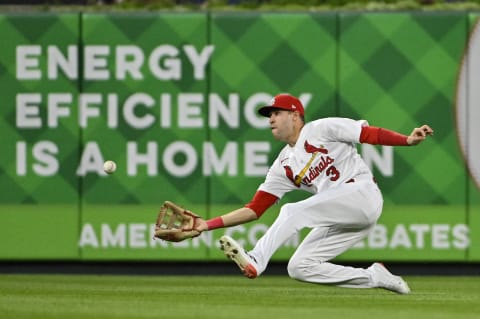 Aug 2, 2022; St. Louis, Missouri, USA; St. Louis Cardinals center fielder Dylan Carlson (3) slides and catches a ball hit by Chicago Cubs center fielder Rafael Ortega (not pictured) during the fifth inning at Busch Stadium. Mandatory Credit: Jeff Curry-USA TODAY Sports