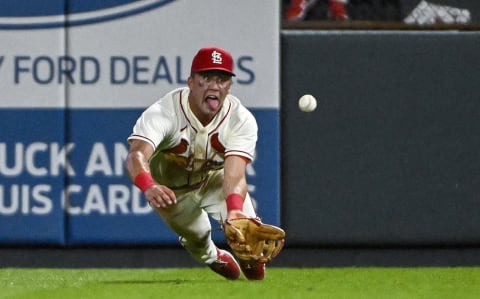 Aug 6, 2022; St. Louis, Missouri, USA; St. Louis Cardinals right fielder Lars Nootbaar (21) dives and catches a line drive hit by New York Yankees catcher Kyle Higashioka (not pictured) during the eighth inning at Busch Stadium. Mandatory Credit: Jeff Curry-USA TODAY Sports