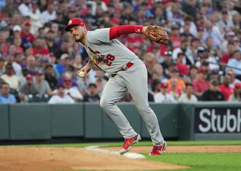 Aug 9, 2022; Denver, Colorado, USA; St. Louis Cardinals third baseman Nolan Arenado (28) fields the ball in the fourth inning against the Colorado Rockies at Coors Field. Mandatory Credit: Ron Chenoy-USA TODAY Sports