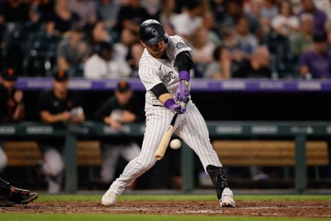 Aug 19, 2022; Denver, Colorado, USA; Colorado Rockies shortstop Jose Iglesias (11) hits an RBI double in the fifth inning against the San Francisco Giants at Coors Field. Mandatory Credit: Isaiah J. Downing-USA TODAY Sports