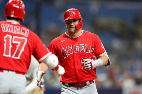 Aug 24, 2022; St. Petersburg, Florida, USA; Los Angeles Angels center fielder Mike Trout (27) is congratulated by designated hitter Shohei Ohtani (17) after hitting a home run against the Tampa Bay Rays in the eighth inning at Tropicana Field. Mandatory Credit: Nathan Ray Seebeck-USA TODAY Sports