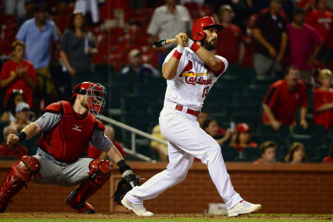 Aug 8, 2016; St. Louis, MO, USA; St. Louis Cardinals third baseman Matt Carpenter (13) hits a two run single off of Cincinnati Reds relief pitcher Tony Cingrani (not pictured) during the ninth inning at Busch Stadium. The Cardinals won 5-4. Mandatory Credit: Jeff Curry-USA TODAY Sports