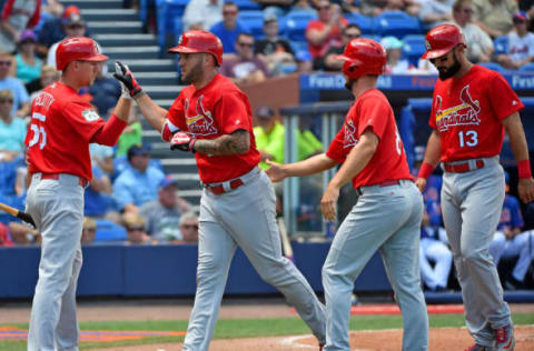 Mar 28, 2017; Port St. Lucie, FL, USA; St. Louis Cardinals first baseman Matt Adams (32) celebrates with right fielder Stephen Piscotty (55) after hitting a three run home run against the New York Mets during a spring training game at First Data Field. Mandatory Credit: Jasen Vinlove-USA TODAY Sports