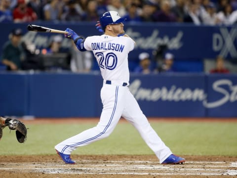 Apr 13, 2017; Toronto, Ontario, CAN; Toronto Blue Jays designated hitter Josh Donaldson (20) hits an RBI double in the sixth inning against the Baltimore Orioles at Rogers Centre. Mandatory Credit: John E. Sokolowski-USA TODAY Sports