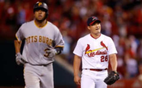 Jun 25, 2017; St. Louis, MO, USA; St. Louis Cardinals relief pitcher Seung-Hwan Oh (26) smiles after the final out of the game is made against Pittsburgh Pirates catcher Elias Diaz (32) for a Cardinals 8-4 victory against the Pirates at Busch Stadium. Mandatory Credit: Scott Kane-USA TODAY Sports